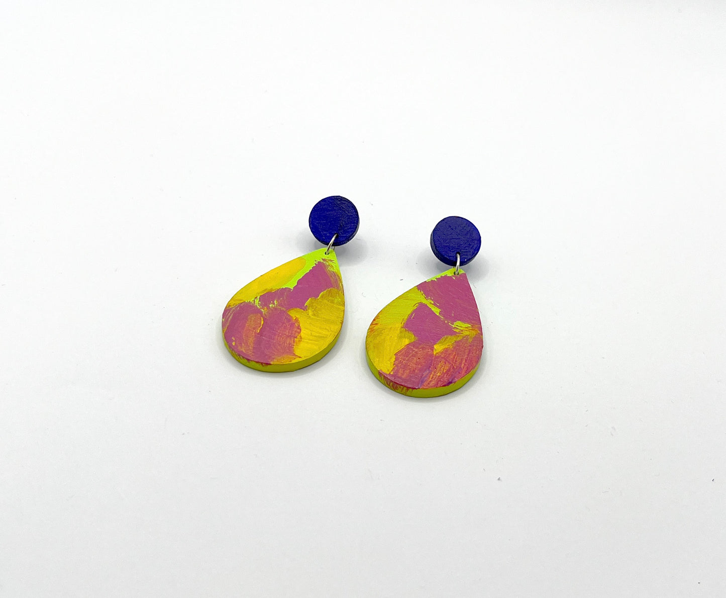 Pair of colorful teardrop earrings on a white background