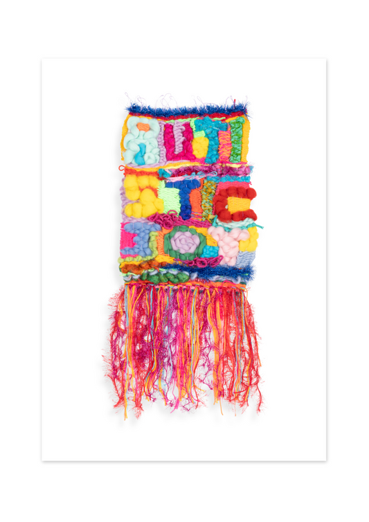 Colorful woven wall hanging with fringe on a white background